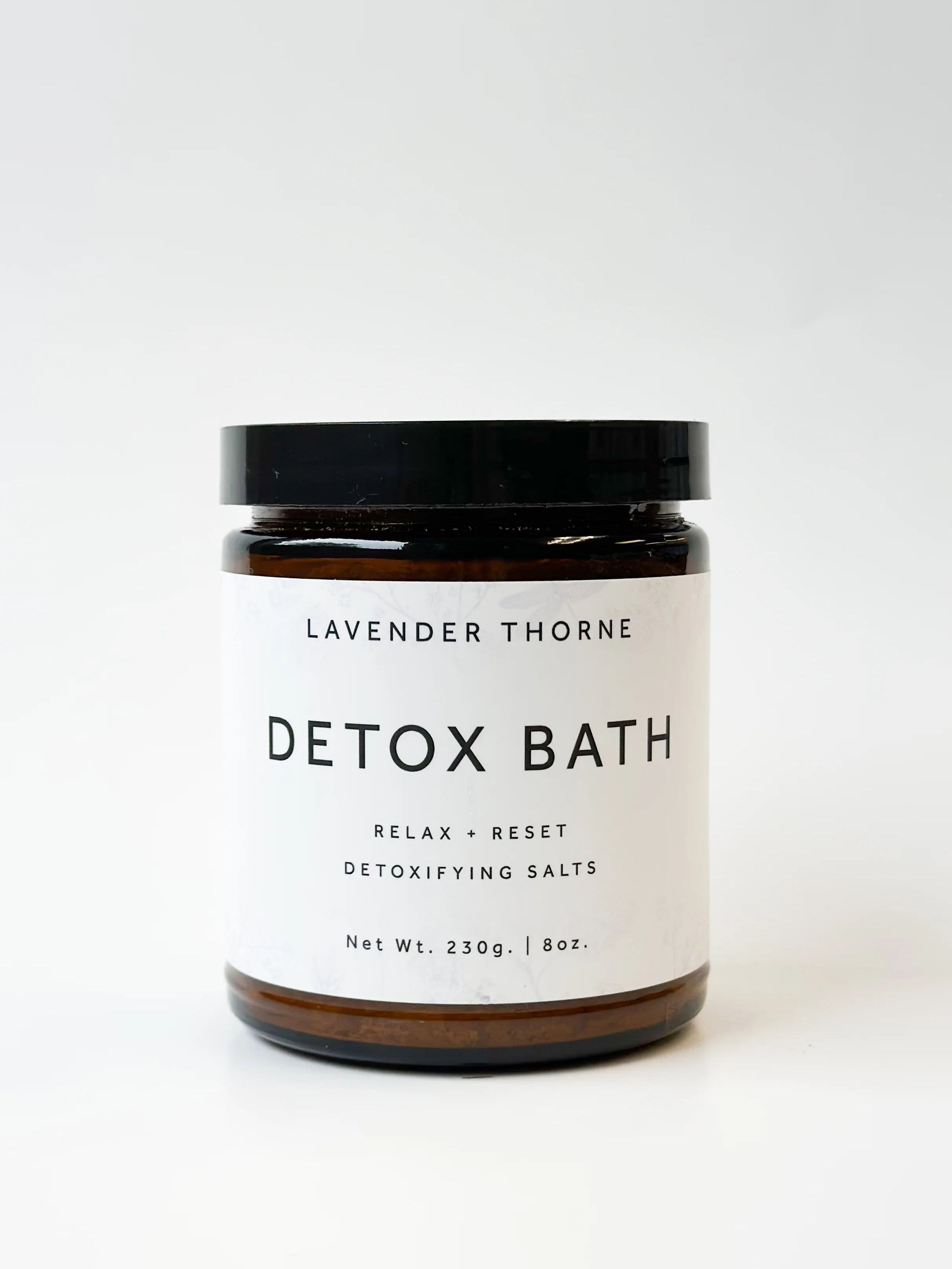 A jar of Lavender Thorne Detox Bath salts with a white label and black lid, set against a clean white background.