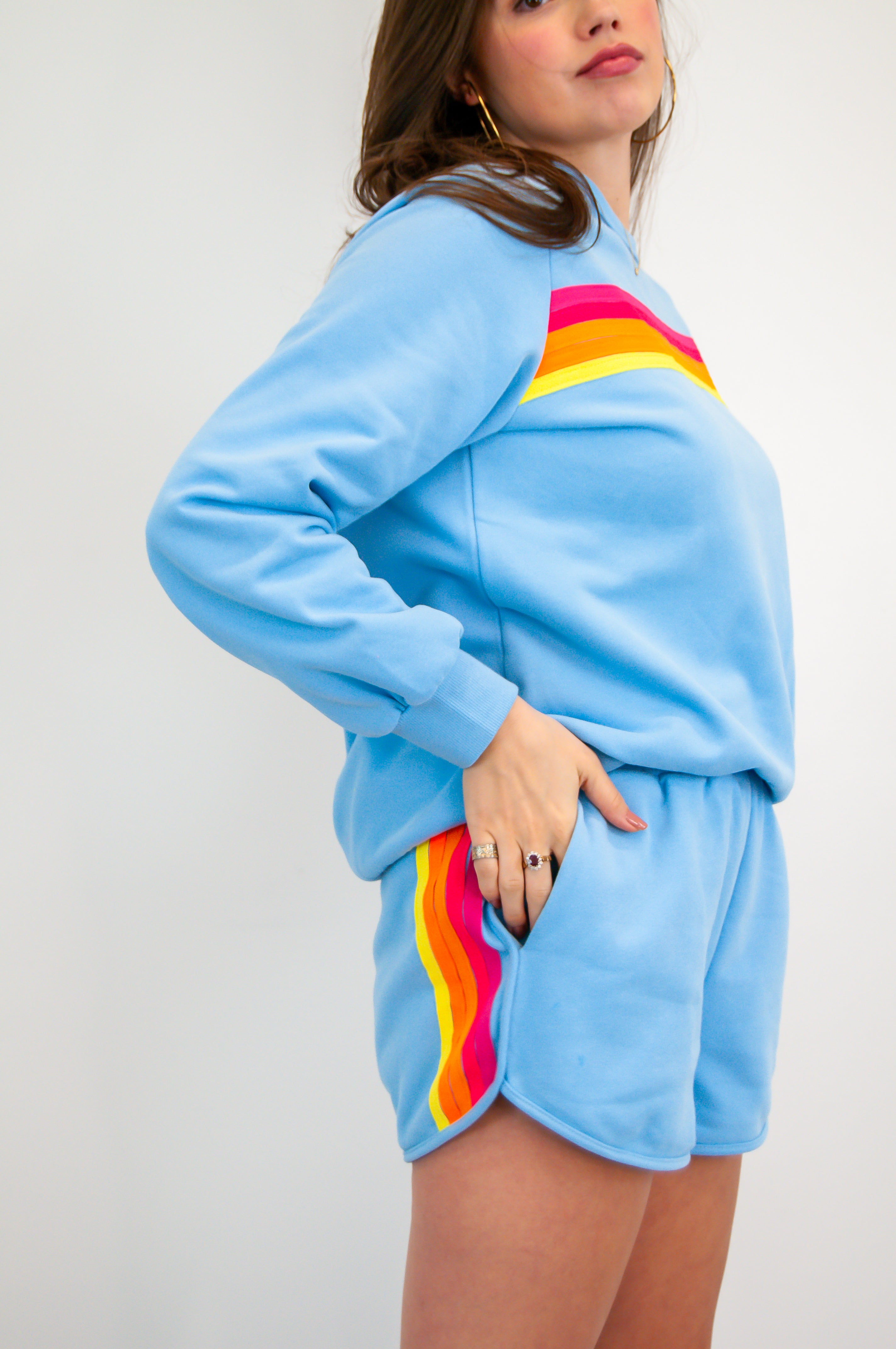 Blue sweatshirt with colorful stripes and matching shorts