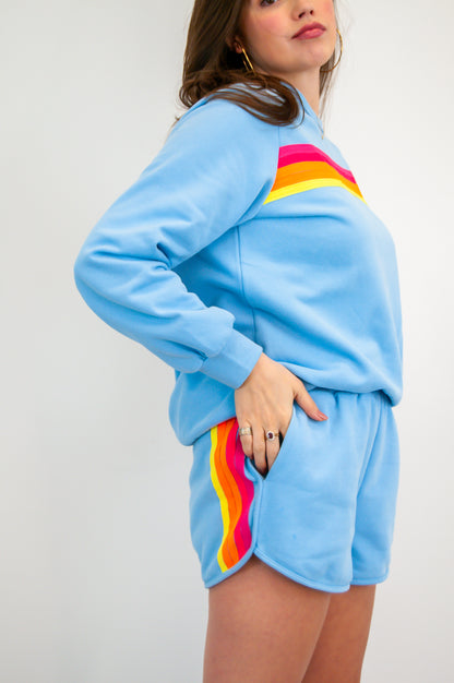 Blue sweatshirt with colorful stripes and matching shorts